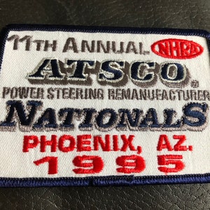 May include: White embroidered patch with blue and gray lettering that reads "11th Annual NHRA ATSCO Power Steering Remanufacturer Nationals Phoenix, AZ 1995".