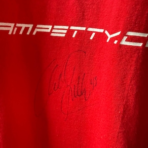 May include: A set of three ceramic nesting bowls in graduated sizes. The bowls are white with a speckled, textured finish and feature a slightly flared rim. Suitable for food preparation or serving.