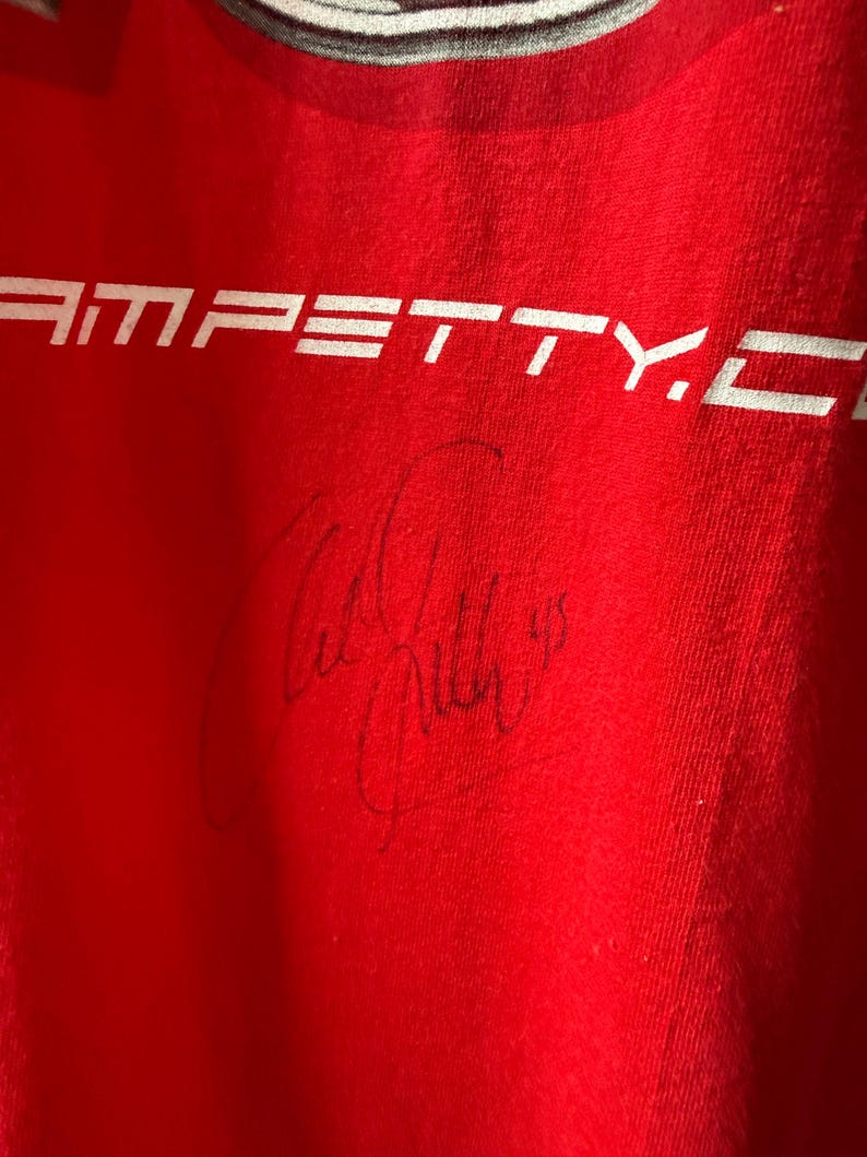 May include: A set of three ceramic nesting bowls in graduated sizes. The bowls are white with a speckled, textured finish and feature a slightly flared rim. Suitable for food preparation or serving.