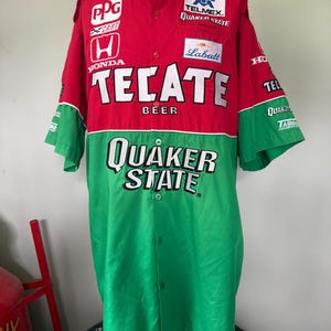 May include: Red and green button-down shirt with sponsor logos and text. The shirt features the words "TECATE BEER" and "QUAKER STATE" prominently displayed. Additional logos include "PPG", "HONDA", and "Labatt".