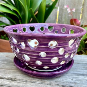 Artisan ceramic purple orchid pot with saucer. Manually carved and pierced. 6" wide and 3+" tall