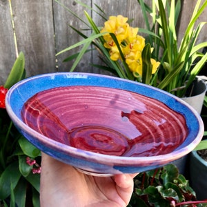 Beautiful mostly red (blue rimmed) porcelain bowl - Medium size multipurpose bowl - Footed salad or soup bowl - Holds 24 ounces - Nice gift!