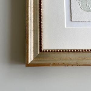 Champagne frame with beading detail
