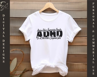 May include: White t-shirt with the text "Attention Deficit Hyperactivity Disorder ADHD Or: as I like to call it, Exceptional Talent" in black. The shirt is hanging on a wooden hanger against a wood-panelled background.