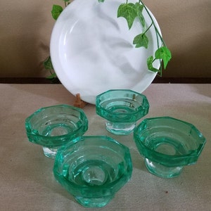 Four Green Glass Candleholders