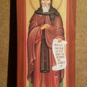 St Benedict of Nursia; words from the Prologue of his Rule for the monastic life read &quot;Walk in the Way of God with the Gospel as guide.&quot;