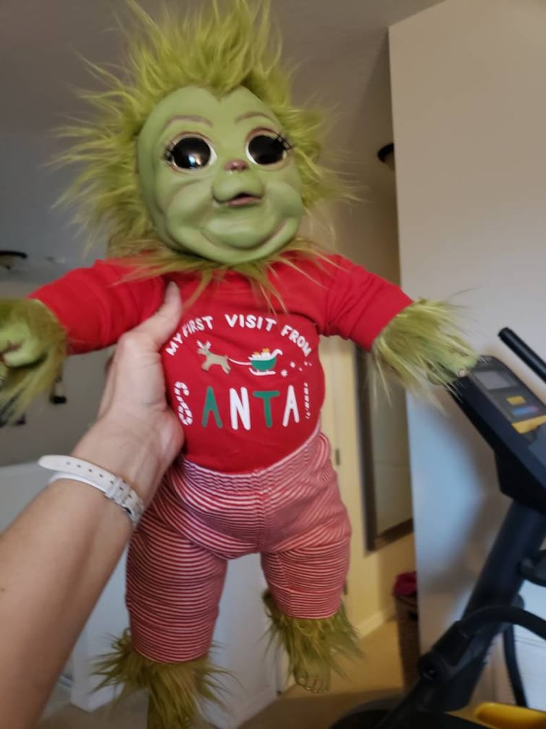 These Baby Grinch Dolls Are Beyond Realistic And Festive For Christmas