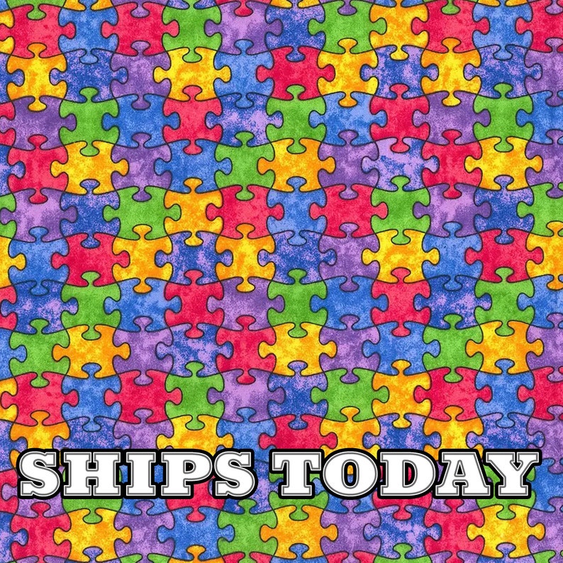 May include: A colorful fabric with a repeating pattern of puzzle pieces in shades of blue, green, yellow, red, and purple. The fabric has a textured, distressed look. The text "SHIPS TODAY" is printed in white letters on a black background at the bottom of the image.