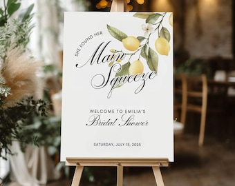 May include: White sign with a lemon branch illustration and the text "She found her Main Squeeze" and "Welcome to Emilia's Bridal Shower" with the date "Saturday, July 15, 2025".