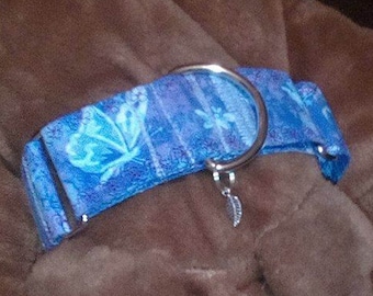 May include: A blue and white patterned dog collar with a silver ring and a silver leaf charm.