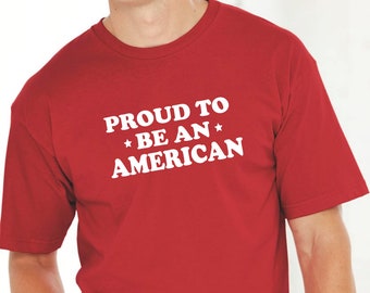 May include: Red t-shirt with white text that reads "Proud to *Be An* American".