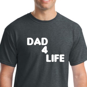 May include: A dark heather grey t-shirt with the text "DAD 4 LIFE" in white.
