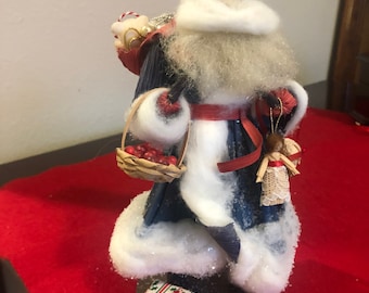 Nan’s corn husk Santa 1991. Blue robe, berry basket, backpack of gifts. One of her finest detailed pieces. A treasure. 9” tall