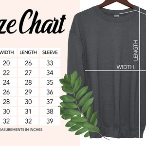 May include: Size chart for a sweatshirt with measurements in inches for width, length, and sleeve length. The chart shows sizes from S to 4XL.