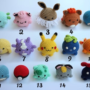 May include: A collection of fifteen crocheted plush toys in various colors and designs. The toys are numbered 1 through 15 and include a variety of characters. The toys are handmade and appear to be part of a larger collection.