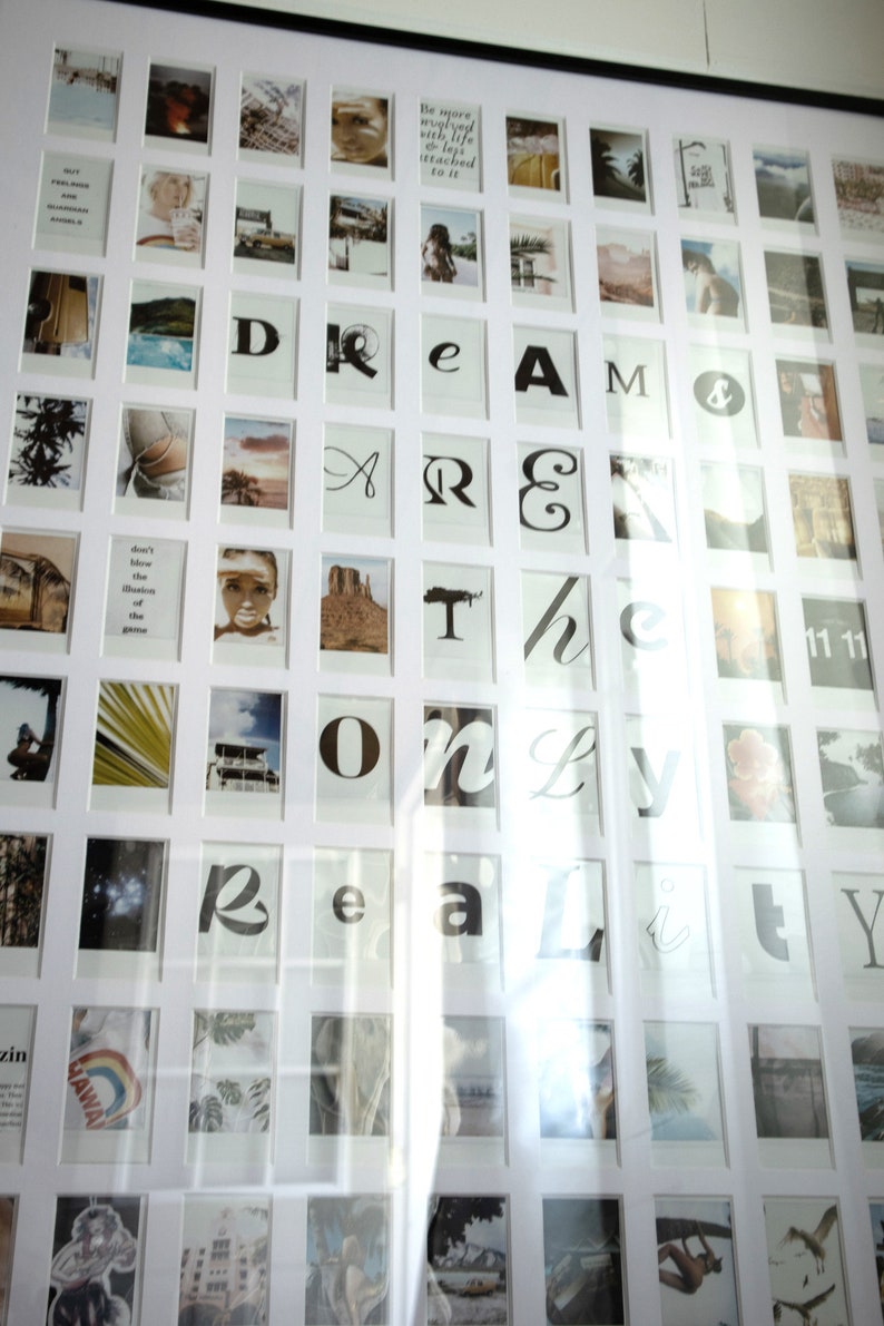 May include: A white picture frame with a black border, containing a collage of photos and text. The text reads "DREAM THE ONLY REALITY".