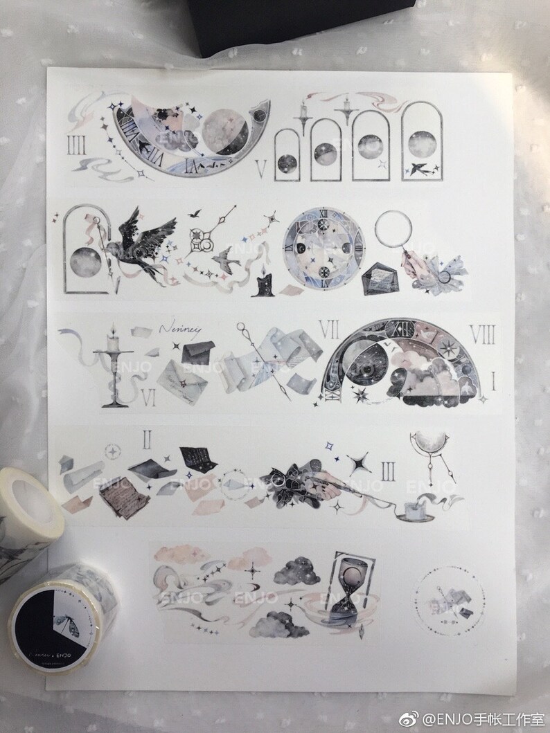 May include: A sheet of decorative washi tape featuring a whimsical, celestial theme. The tape features illustrations of clocks, moons, stars, and other celestial objects in shades of grey, blue, and pink. The tape is perfect for adding a touch of whimsy to journals, planners, and other craft projects.