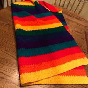 Rainbow crochet throw. 44” x 40”. Rainbow stripes.