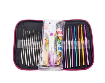 May include: A pink carrying case with a variety of colorful crochet hooks and knitting needles. The case has a zipper closure and is filled with tools for crafting.