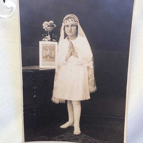 Old photo 1910, portrait of girl, portrait of child, girl who prays, vintage photograph, girl in white dress, girl near icon, Tsarist Russia