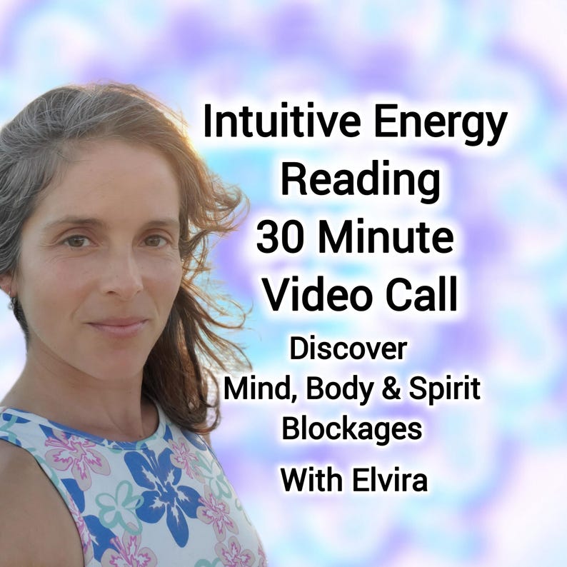 May include: A person with shoulder-length hair wearing a floral top with blue, pink, and white flowers. Text reads: Intuitive Energy Reading 30 Minute Video Call Discover Mind, Body & Spirit Blockages With Elvira against a blurred background.