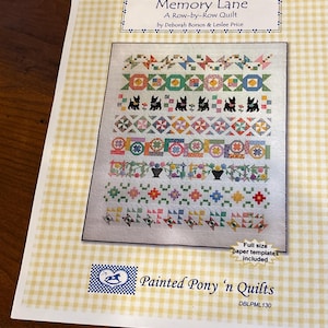 May include: A printed pattern for a "Memory Lane" row-by-row quilt by Deborah Borsos & Leslee Price. The quilt design features various colorful patchwork blocks, including floral, geometric, and animal motifs. The pattern includes full-size paper templates.
