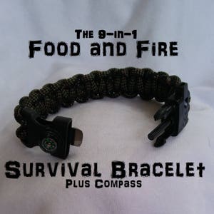 May include: A survival bracelet with a black clasp and a built-in compass. The bracelet is made of a green and brown camouflage-patterned cord. Text on the image reads "THE 9-IN-1 FOOD and FIRE SURVIVAL BRACELET PLUS COMPASS."