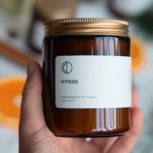 Hygge Cinnamon, Clove, Nutmeg, Orange, Ginger essential oil candle. soy wax candle in amber jar image 3