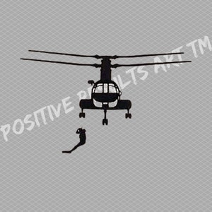 May include: A black silhouette of a helicopter with a person hanging from a rope underneath. The helicopter has a large, round body and a long, thin tail.