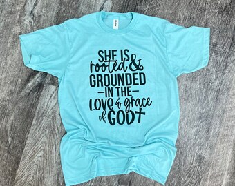 She Is Rooted And Grounded In The Love And Grace Of God T-shirt - Christian T-shirt - Jesus Tee - Womens Graphic T-shirt | Church Mom Tee
