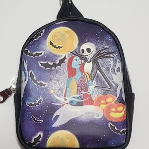 May include: Miniature backpack featuring a spooky scene with Jack Skellington, Sally, and pumpkins under a full moon. The design is set against a dark purple starry sky with bats and ghosts. The backpack has a black trim and a silver zipper.