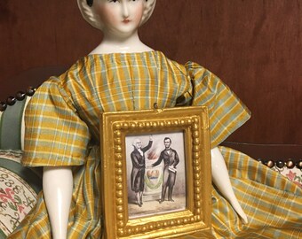 Miniature gilded framed artworks by currier and Ives