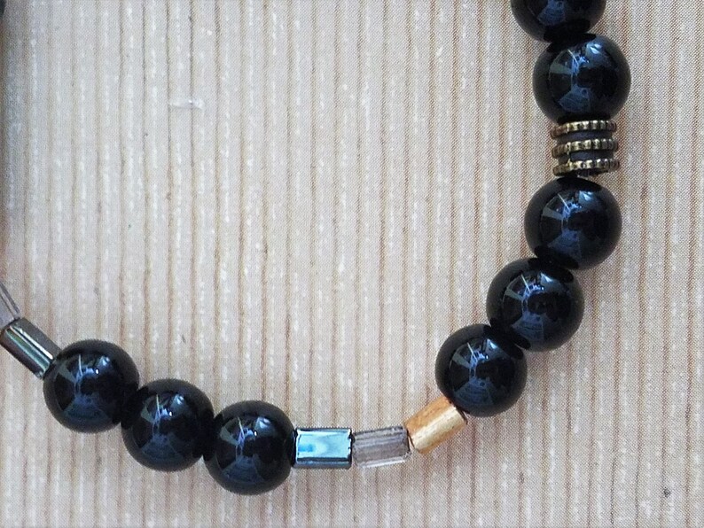 Handmade Stretchy Black /& Gold Bracelet with Hints of Silver and Clear Rectangular Beads