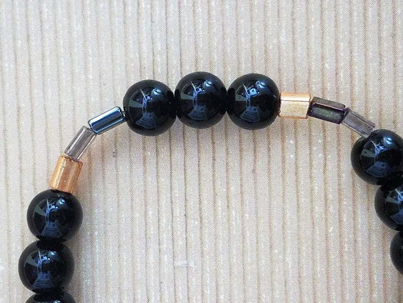 Handmade Stretchy Black /& Gold Bracelet with Hints of Silver and Clear Rectangular Beads