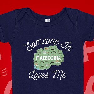 Macedonia Baby Bodysuit: &quot;Someone Loves Me&quot; Cotton One Piece