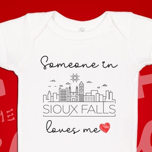 Sioux Falls Baby One Piece | Someone Loves Me In Sioux Falls Bodysuit | Somebody In South Dakota Loves Me | Long Distance Baby Gift | SD