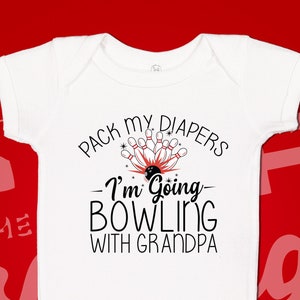 May include: White baby onesie with black text that reads "Pack my diapers - I'm going bowling with grandpa". A red and white bowling pin and ball graphic is above the text.