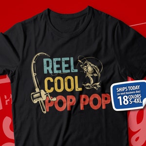 May include: Black t-shirt with a vintage-style graphic of a fishing rod and fish. The text "Reel Cool Pop Pop" is printed on the shirt.