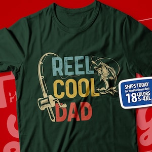 May include: Green t-shirt with a fishing rod and fish graphic. The text "REEL COOL DAD" is printed on the shirt in a vintage style.