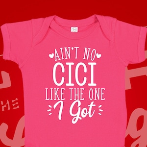May include: Pink baby onesie with white text that reads "Ain't no Cici like the one I got".
