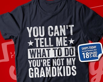 May include: A navy blue t-shirt with white text that reads "You can't tell me what to do you're not my grandkids". The shirt has a distressed look and is available in 18 colors and sizes S-4XL.