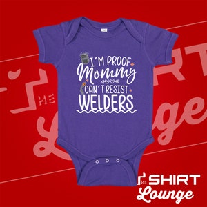 May include: Purple baby onesie with white text that reads "I'm proof mommy can't resist welders".