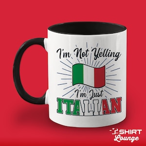May include: White ceramic mug with a black handle and black rim. The mug has a graphic of the Italian flag with the text "I'm Not Yelling I'm Just ITALIAN".
