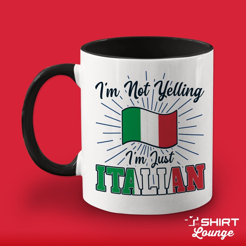 May include: White ceramic mug with a black handle and black rim. The mug has a graphic of the Italian flag with the text "I'm Not Yelling I'm Just ITALIAN".