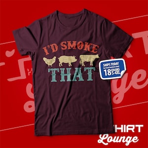 May include: A maroon t-shirt with a vintage-style graphic that says "I'd Smoke That" and features a chicken, pig, and cow. The graphic is in shades of blue, green, red, and yellow. The shirt also has a white label with the text "Ships Today (or next business day) 18 Colors S-4XL".