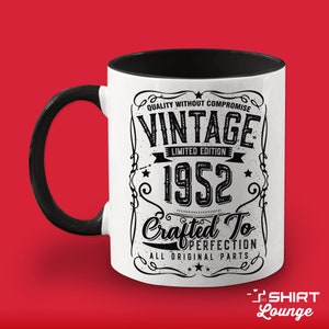May include: White ceramic mug with a black handle and black interior. The mug features a vintage-style design with the text "Quality Without Compromise Vintage Limited Edition 1952 Crafted To Perfection All Original Parts".