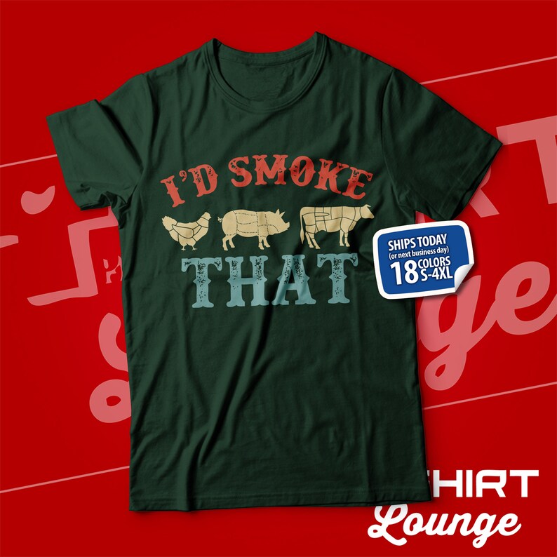 May include: Green t-shirt with the text "I'd Smoke That" in red, white, and blue. The text is surrounded by images of a chicken, pig, and cow. The shirt also has a small white label with the text "Ships Today (or next business day) 18 Colors S-4XL".