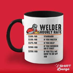 May include: White ceramic mug with a black handle and black rim. The mug features a graphic of a welder with the text "Welder Hourly Rate" and a list of hourly rates with corresponding descriptions. The text "SHIRT Lounge" is at the bottom of the mug.
