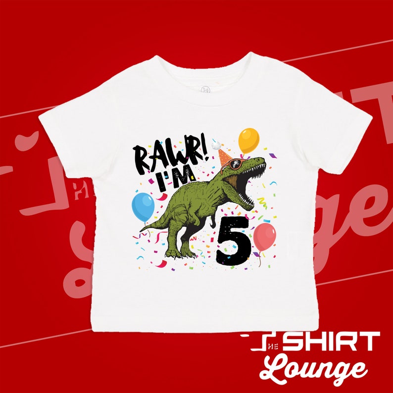 May include: White t-shirt with a green dinosaur wearing sunglasses and a party hat. The dinosaur is saying "Rawr! I'm 5" with confetti and balloons around it.