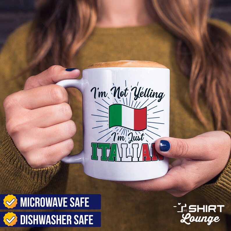 May include: White ceramic mug with a black and red design. The mug features the text "I'm Not Yelling I'm Just Italian" with an Italian flag graphic. The mug is microwave and dishwasher safe.